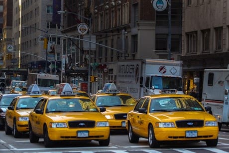 Taxis lined up on a city street