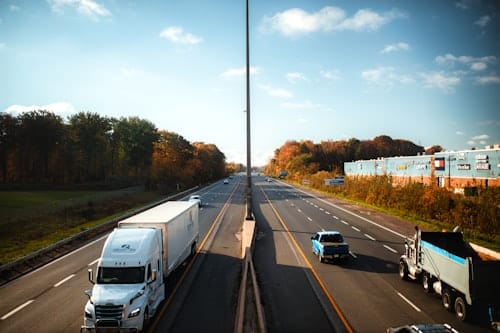Delivery trucks on a highway