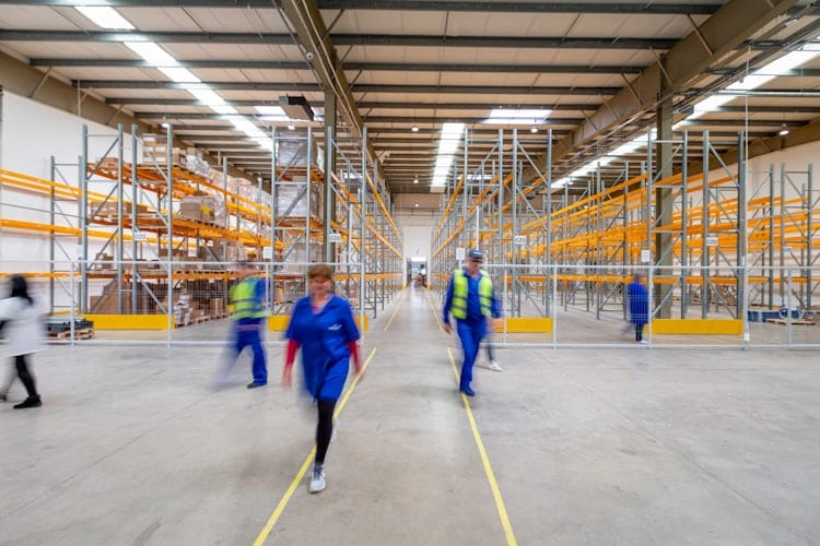 Logistics team reviewing fleet operations in a warehouse