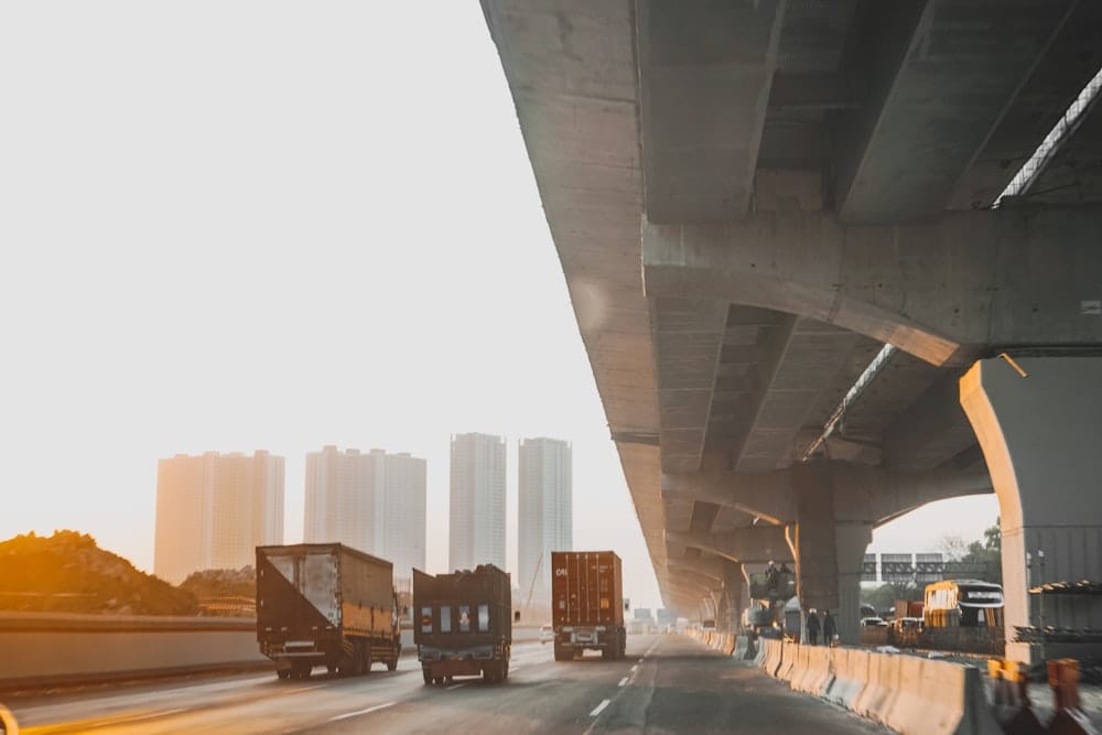 Fleet trucks on a highway tracked in real time by FairDeal IVMS